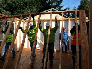 Courtesy of Habitat for Humanity of Mason County - ProBuild crew volunteered to help raise the last interior wall of fellow employee Craig Burdick