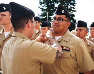 Moving on up...Hospital Corpsman 1st Class Vi J. Potal is pinned by
HM1 Shaun Aragon during Naval Hospital Bremerton's Frocking Ceremony for 43
Sailors on June 3, 2016. Not only did Potal advance in rate, but he found
out he passed on the same day as he was preparing for his commencement
ceremony to accept his Bachelor of Science degree in Psychology (Official
Navy photo).