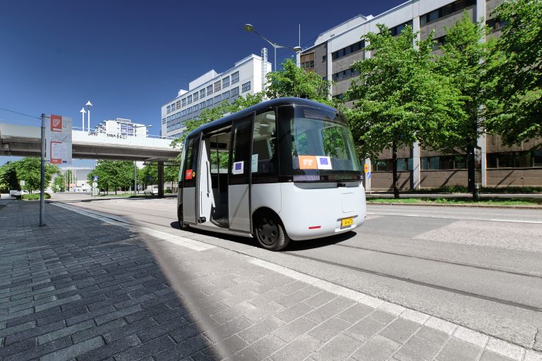 Helsinki, Finland - June 12, 2020: The FABULOS Project - testing self-driving bus in city street in Pasila district. Helsinki, Finland - June 12, 2020: The FABULOS Project - testing self-driving bus in city street in Pasila district.