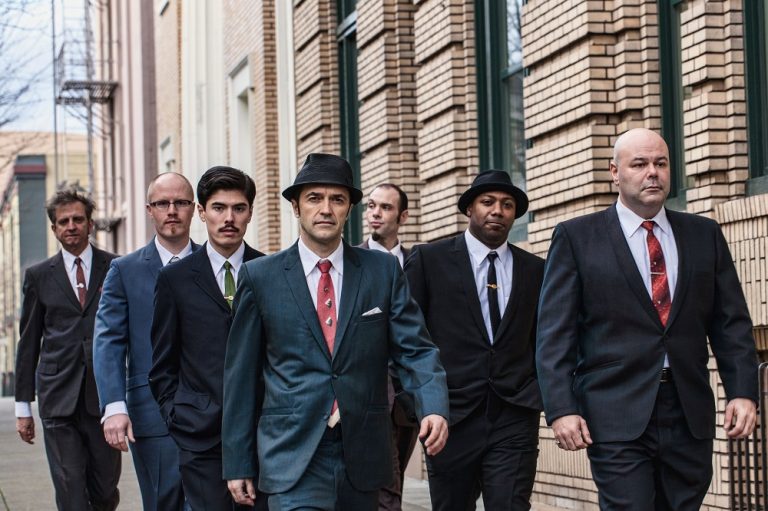Photo of Cherry Poppin' Daddies walking down a city street