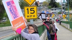 Protestors wave signs on the Manette Bridge on May 7 in reaction to the Supreme Court decision that would overturn Roe v. Wade