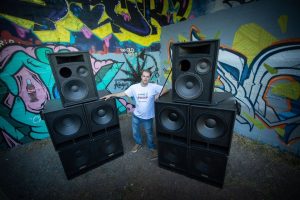 Andrew Cudlipp posing with AC AUDIO handbuilt sound system