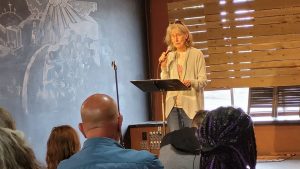 Cindy Frederick speaks at the Coffee Oasis's 25th anniversary celebration on Sunday (Photo by Kitsap Scene) Cindy Frederick speaks at the Coffee Oasis's 25th anniversary celebration on Sunday