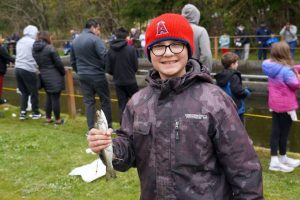 Brian Nevarez, 11, holds up the fish he caught Saturday (Photo by Kitsap Scene) Brian Nevarez, 11, holds up the fish he caught Saturday
