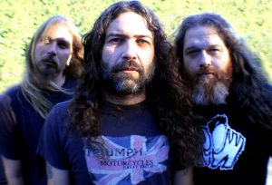 The original lineup of Mos Generator, from left to right: Drummer Shawn Johnson; Bassist Scooter Haslip and Guitarist and Vocalist Tony Reed (Courtesy of Mos Generator) The original lineup of Mos Generator, from left to right: Drummer Shawn Johnson; Bassist Scooter Haslip and Guitarist and Vocalist Tony Reed