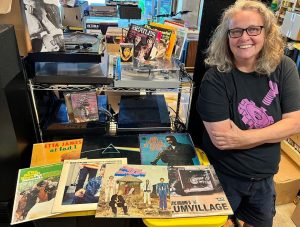 Melanie Peters poses with Rockin' Ruby's merchandise