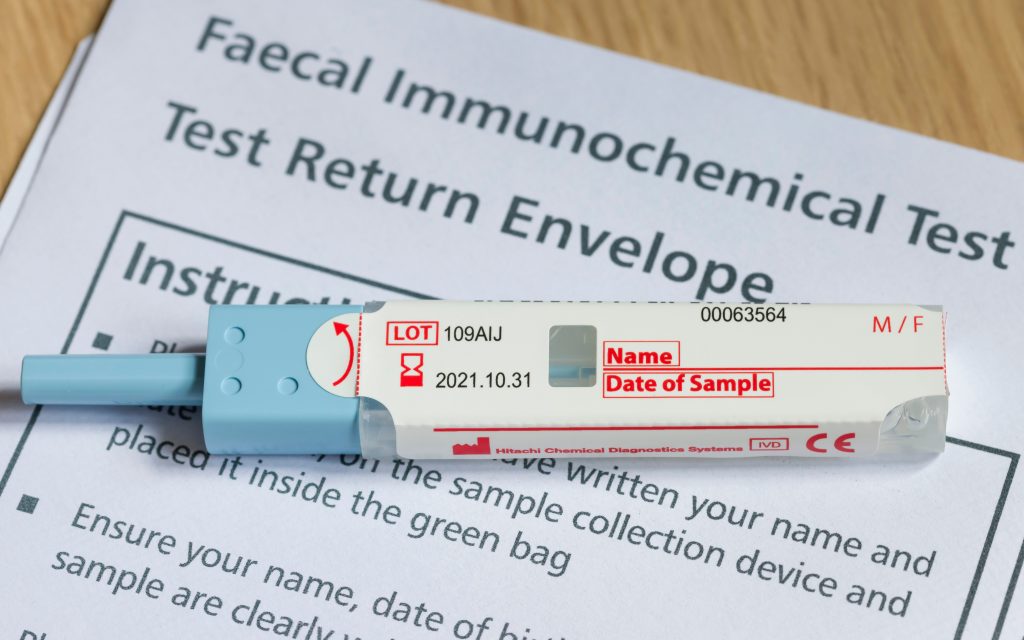 Closeup of FIT test (faecal immunochemical test), a fecal occult blood test for screening bowel cancer