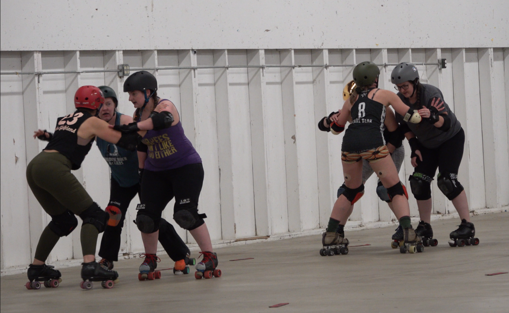 Members of West Sound Roller Derby at a recent practice at the Kitsap County Fairgrounds