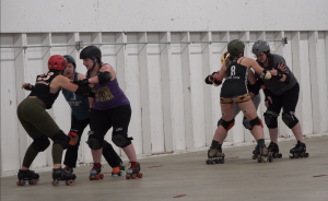 Members of West Sound Roller Derby at a recent practice at the Kitsap County Fairgrounds
