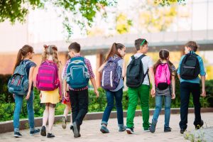 Group of kids going to school together.