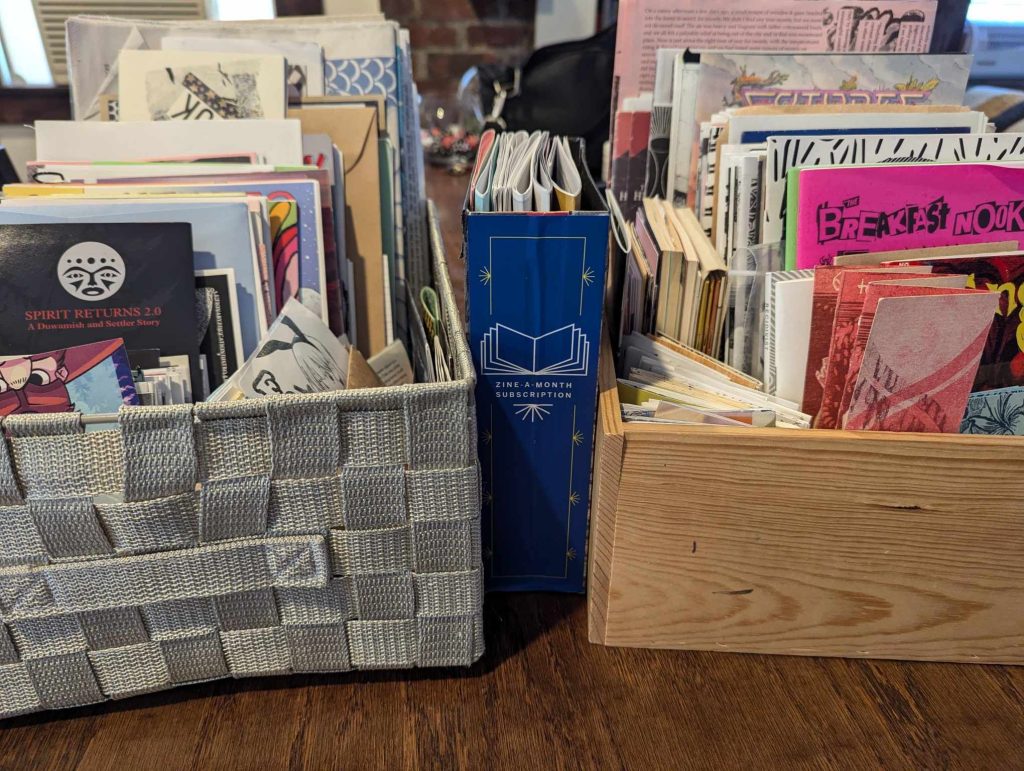 Two baskets filled with zines