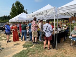 People gather around vendor booths at last year's Puget Sound Book Festival.